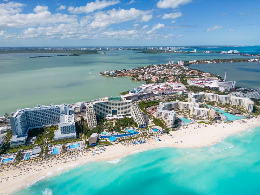Aerial view of Cancun all inclusive resorts along the turquoise Caribbean beach