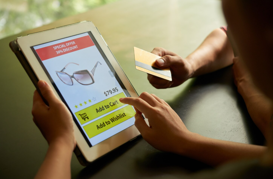 Checking fake online deals on a shopping website showing sunglasses with a discount.