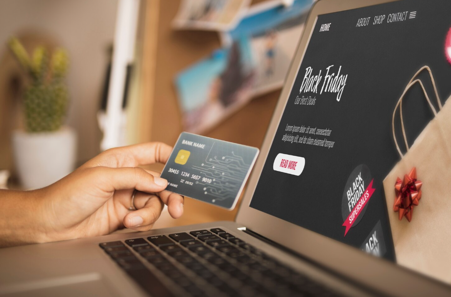 Online shopper entering credit card details, checking for safe tech deals and avoiding scams.