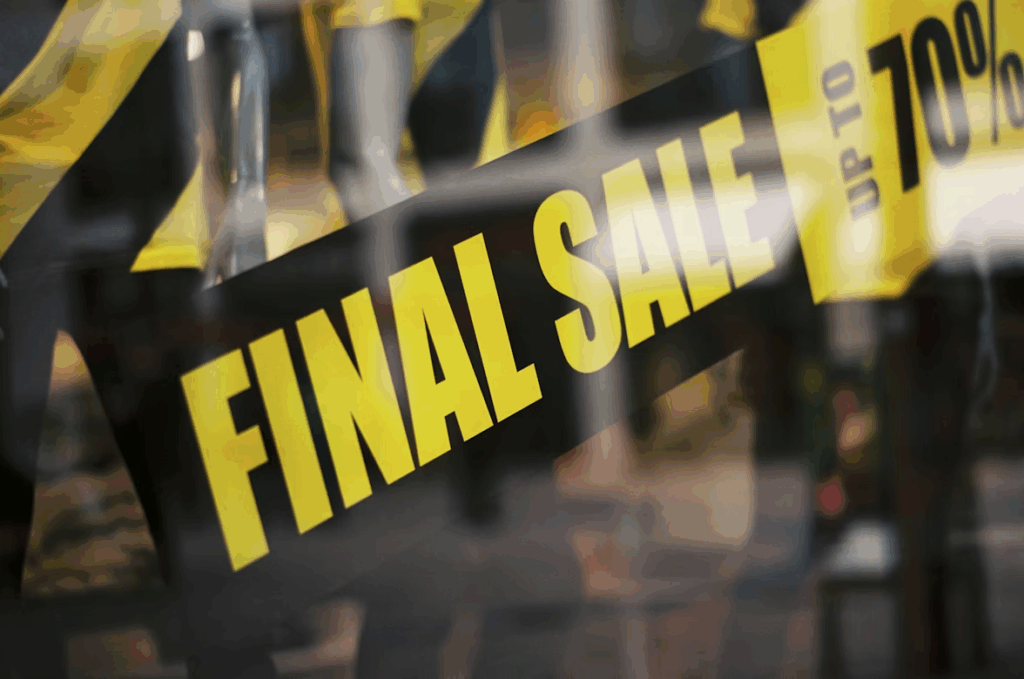 Storefront with a bold final sale sign promoting discounts up to 70 percent.