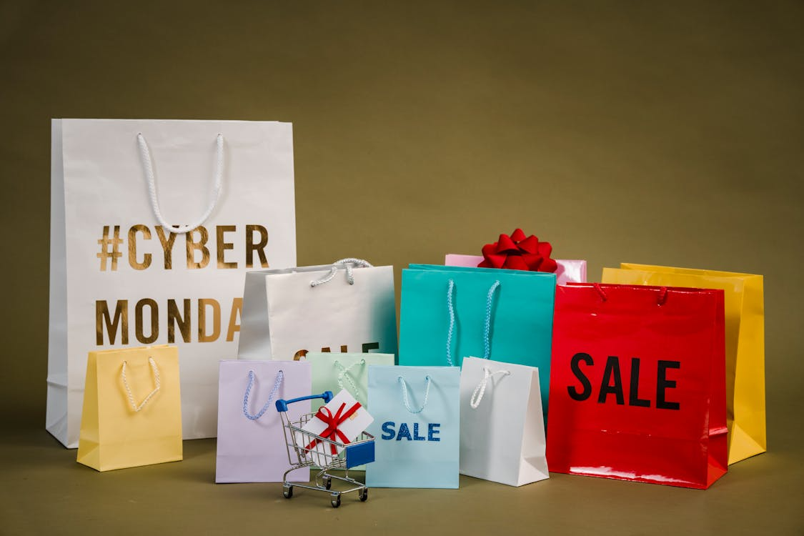 Colorful shopping bags with Cyber Monday and sale signs