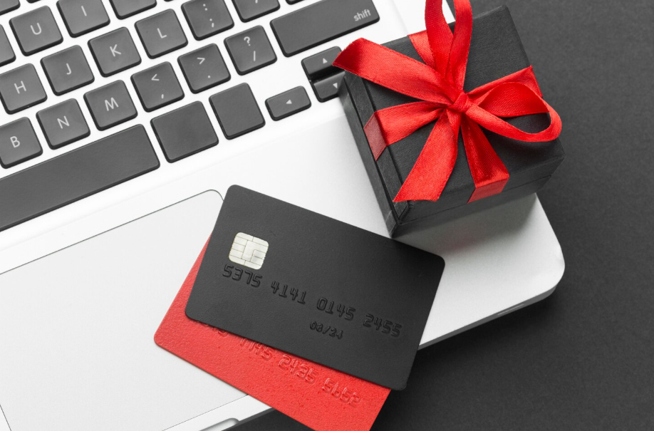 Gift cards and a present box, symbolizing turning unused gift cards into cash online.